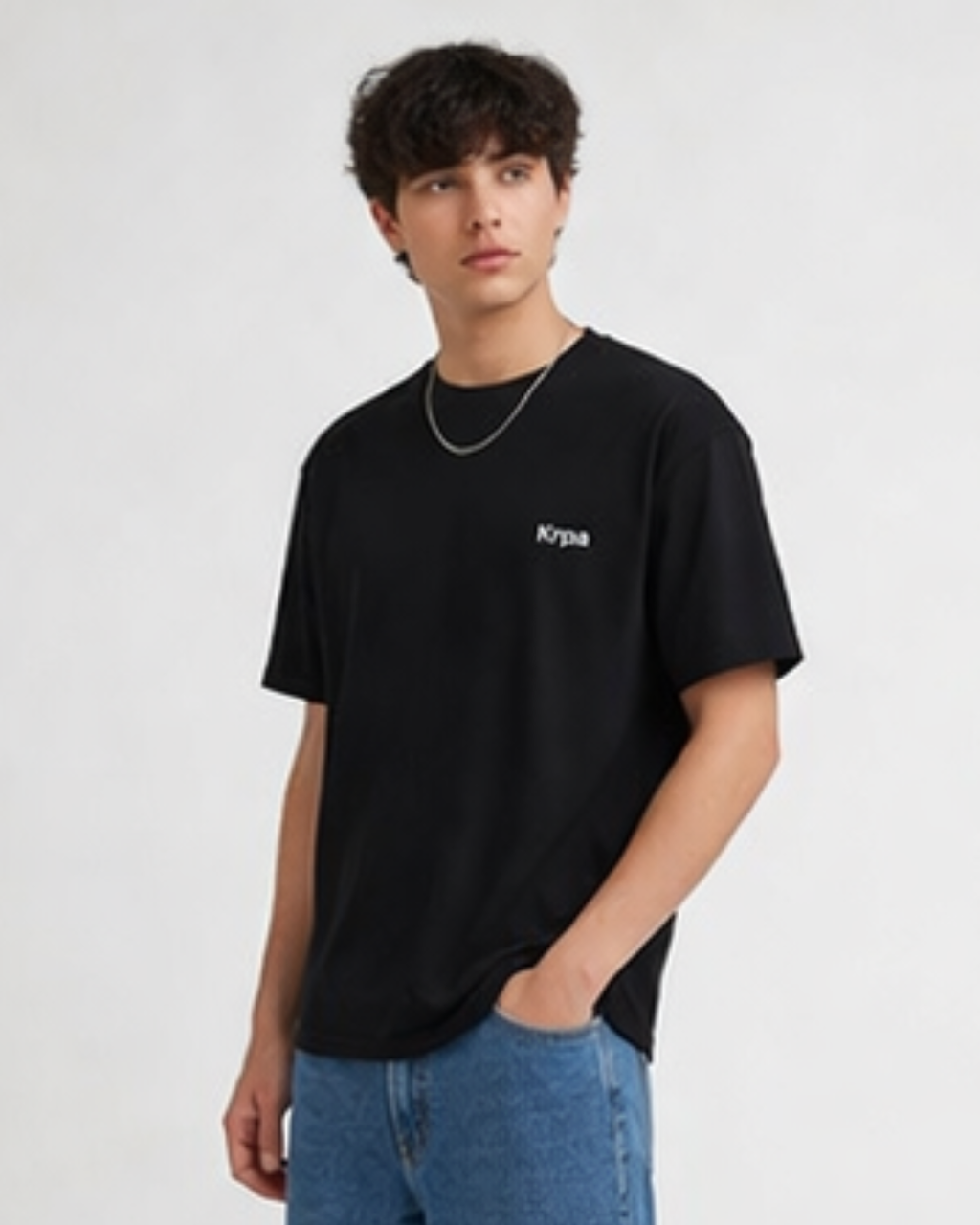 Person wearing a black t-shirt with krpa logo on a white background