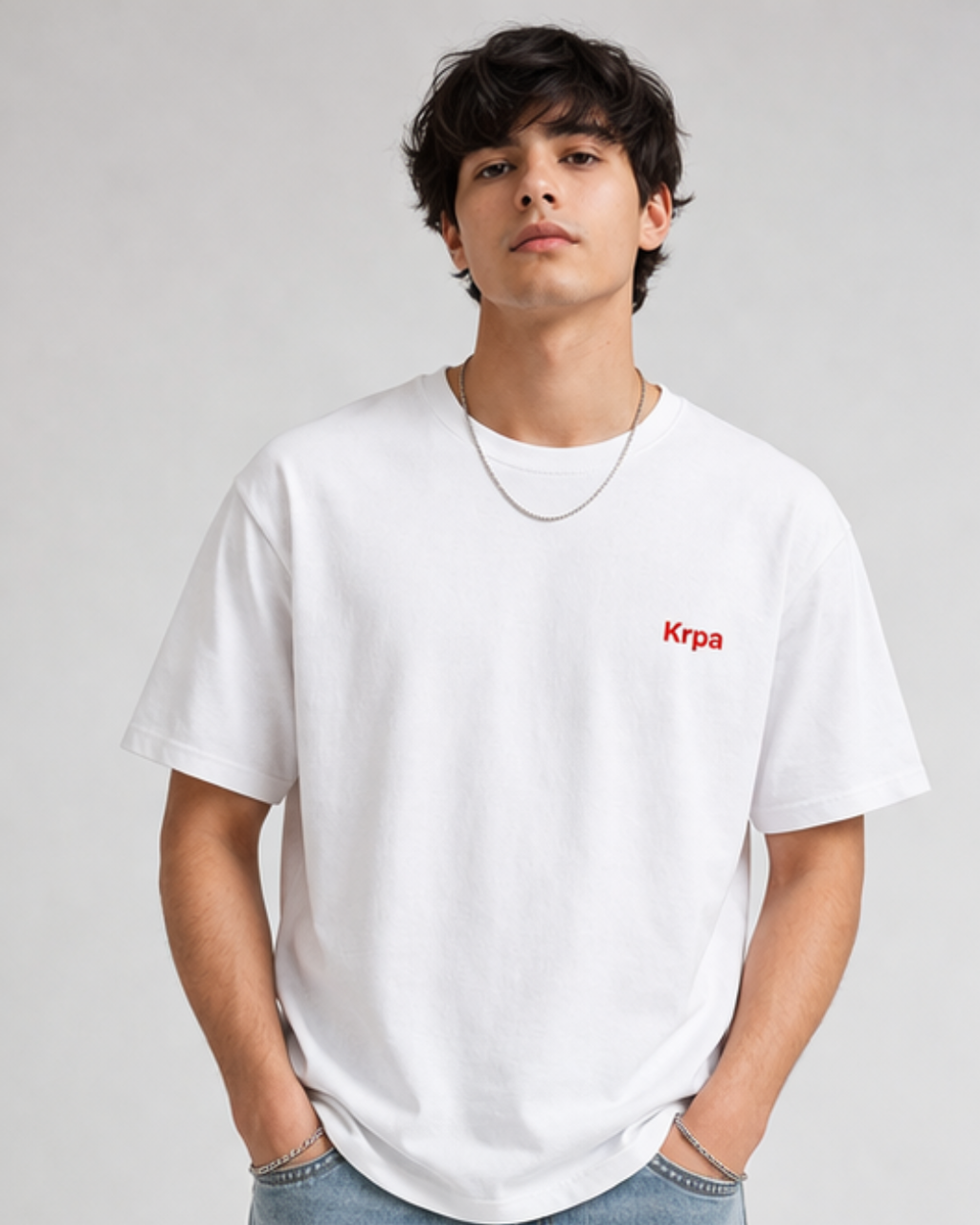 Man wearing white casual t shirt with relaxed fit and minimal everyday style