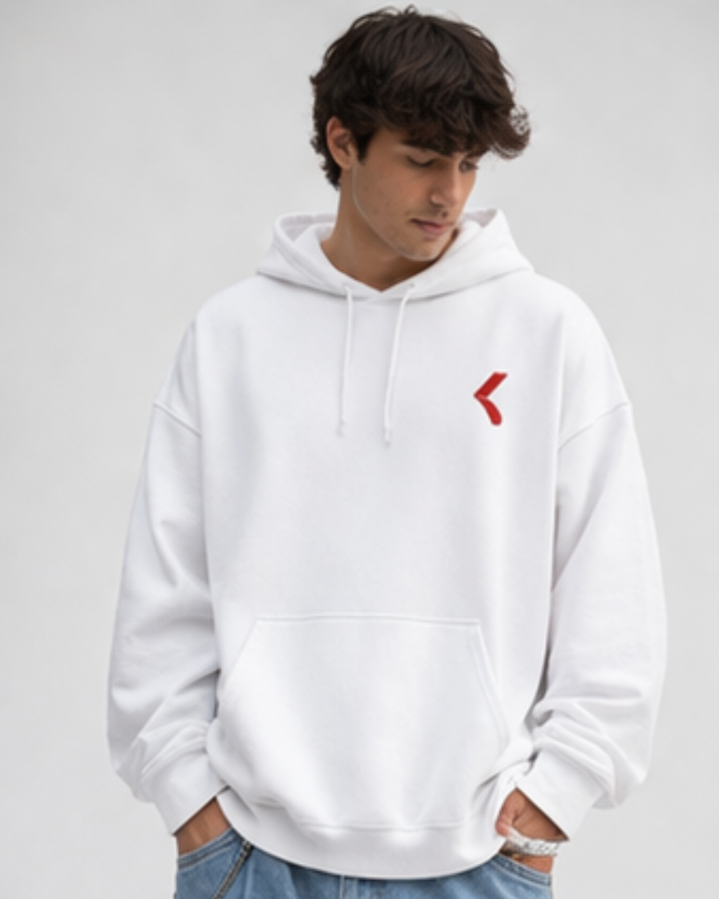 Person wearing a white hoodie with a red KRPA logo on a plain background