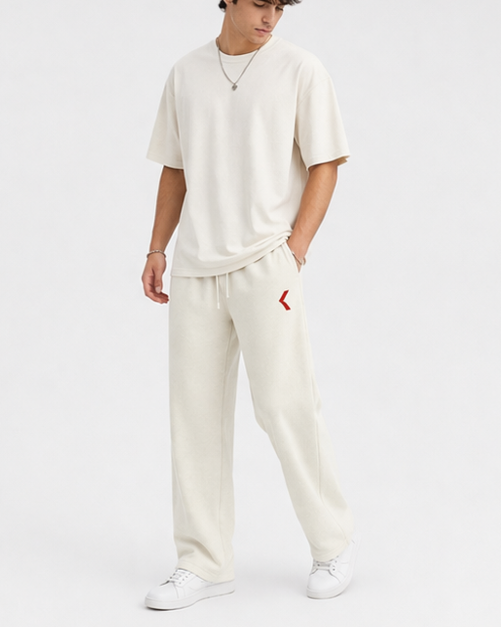Person wearing off white outfit with KRPA logo on a white background