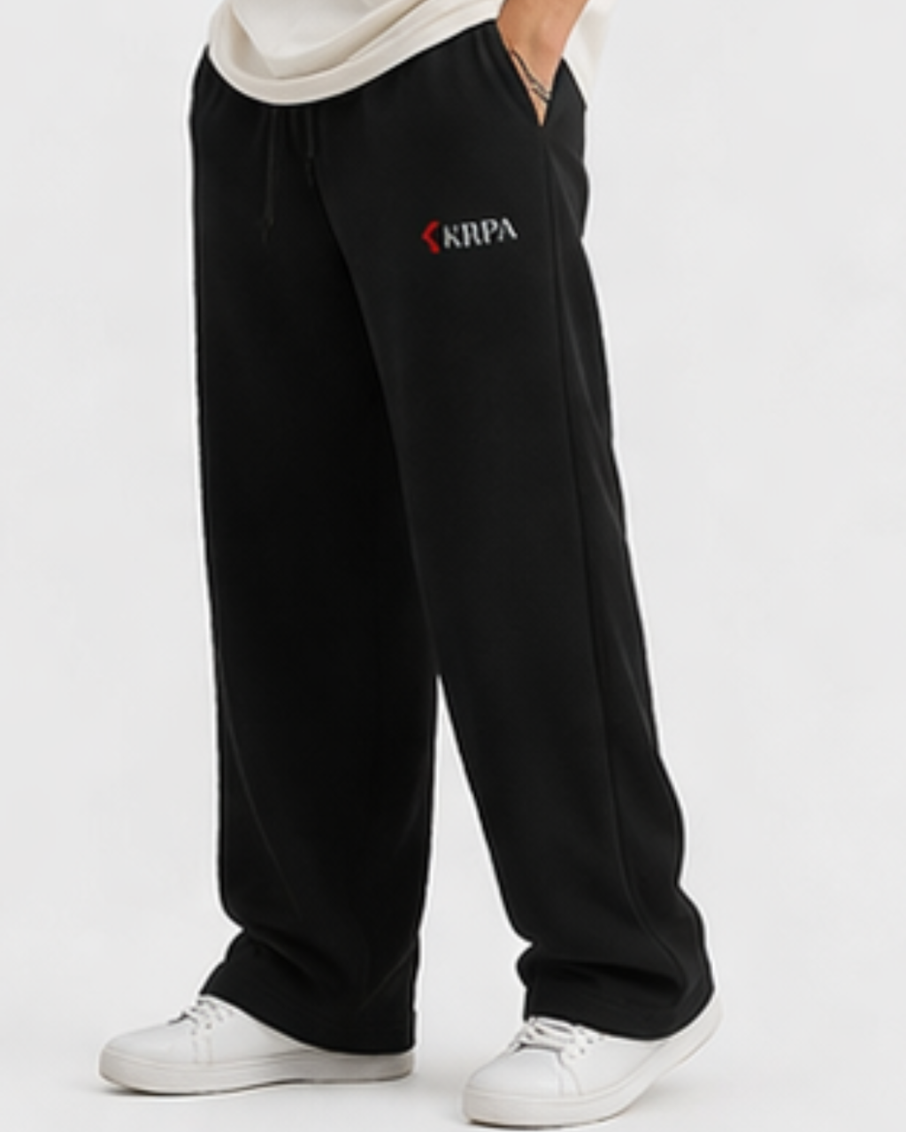 Black sweatpants with KRPA logo on a white background