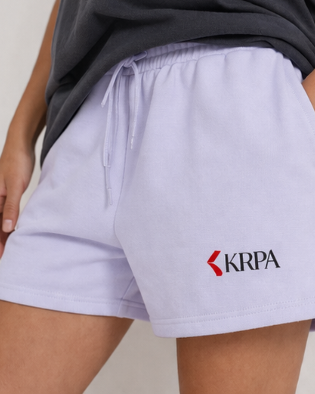 Light purple shorts with a KRPA logo on a neutral background