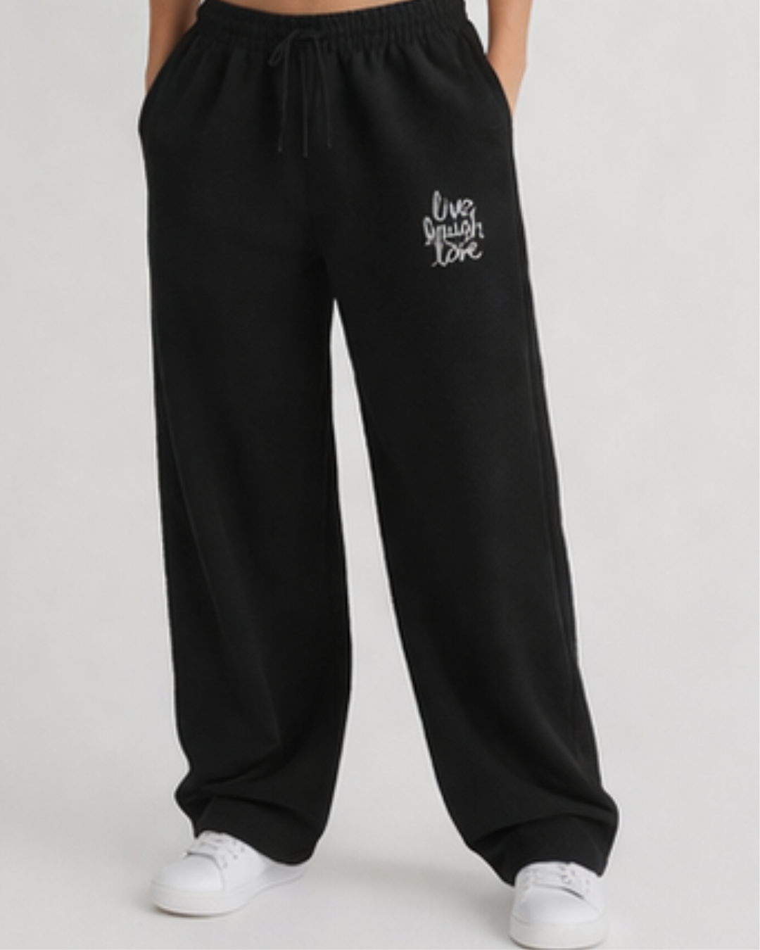 Black sweatpants with white text on a plain background
