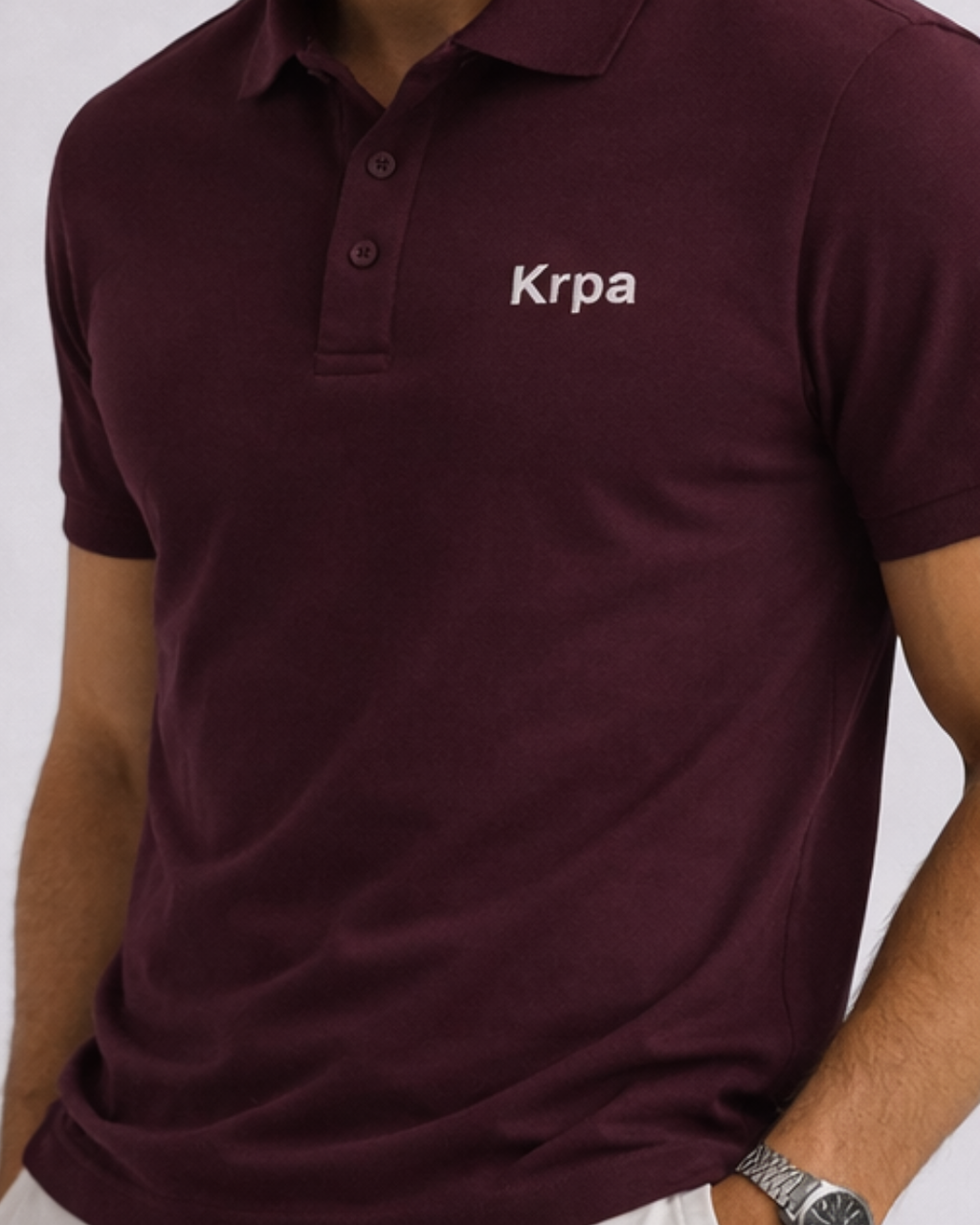 Maroon polo shirt with 'Krpa' branding on a white background