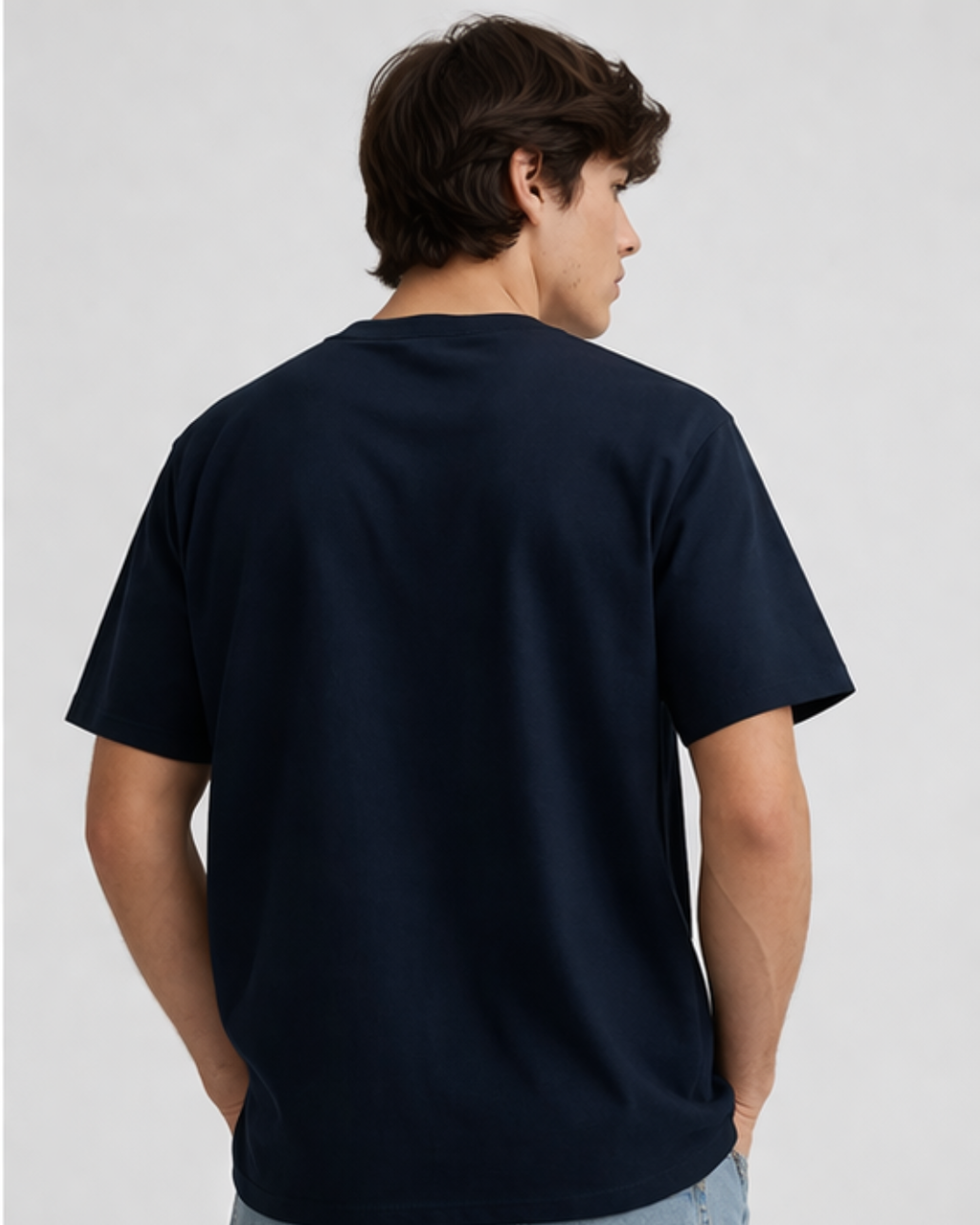 Person wearing a navy blue t-shirt on a light gray background