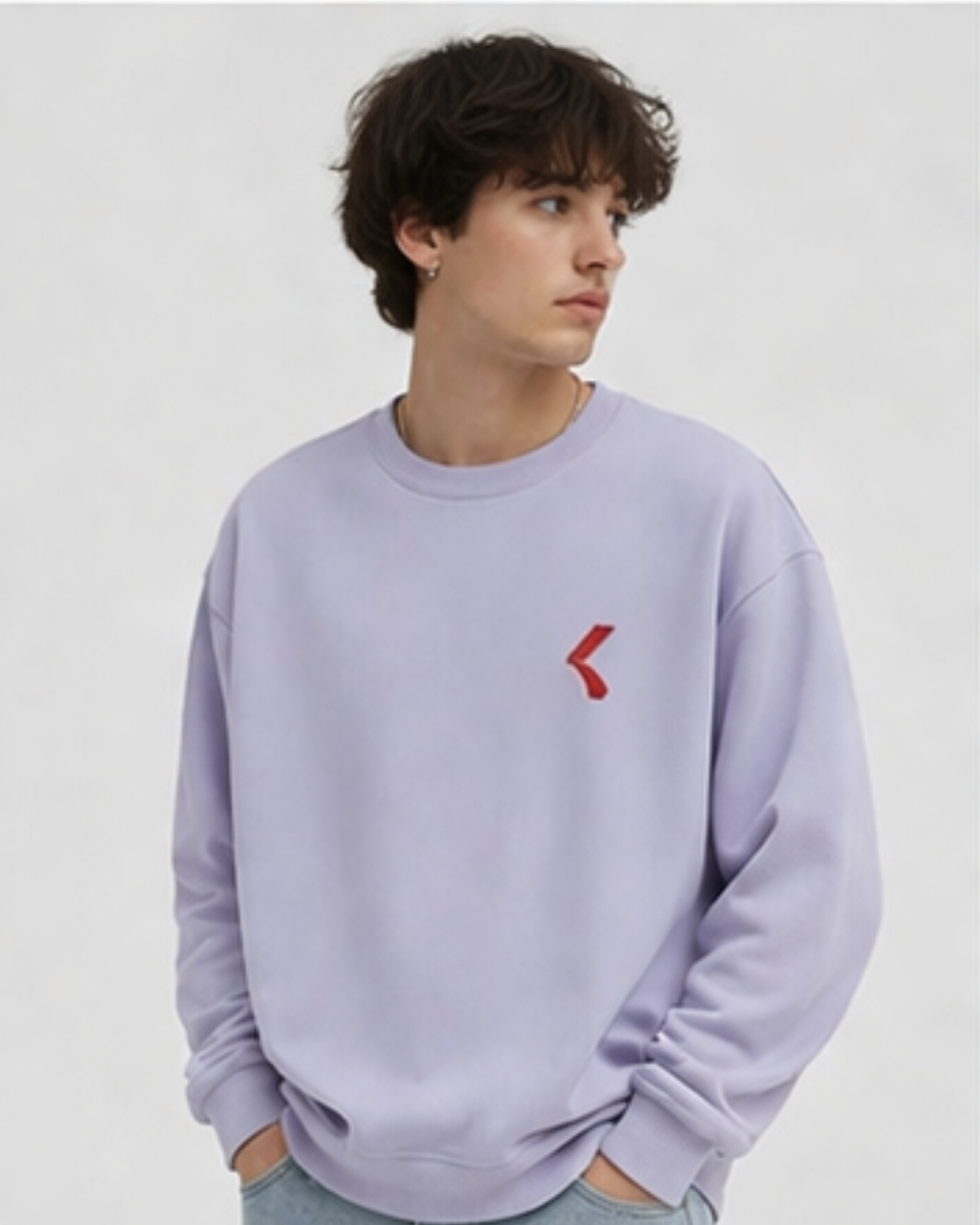 Person wearing a lavender sweatshirt with a KRPA logo on a plain background