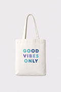 Tote bag with 'Good Vibes Only' text on a light gray background